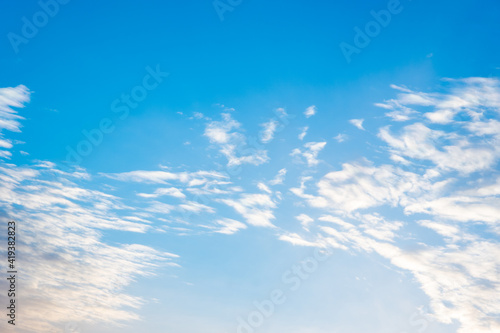 Natural sunny blue sky background with beautiful puffy white cumulus clouds and fluffy cirrus clouds. Beautiful natural sky background, copy space