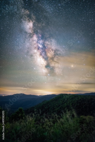 The Milky Way shining through light pollution over Shenandoah National Park in the Summer.