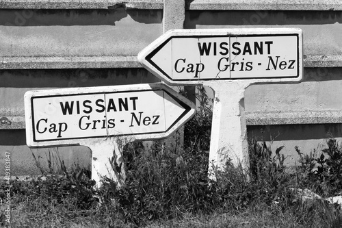 Old stone direction signs with 'Wissant' written on them photo