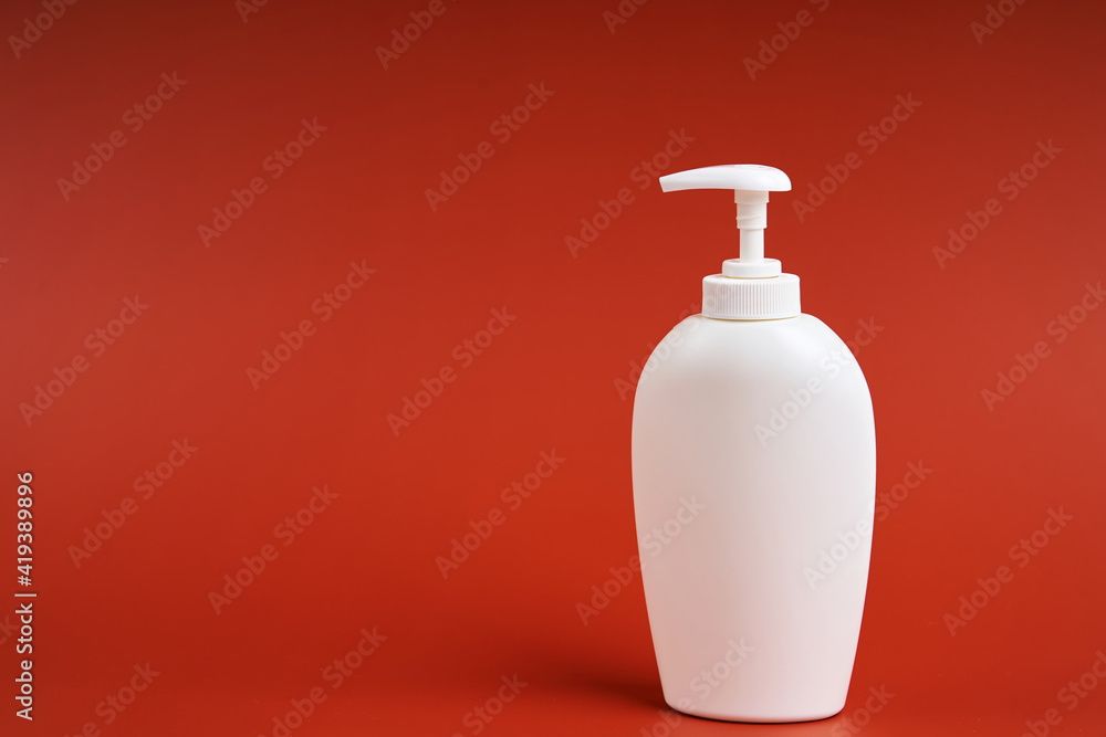 Clean white plastic bottle with soap dispenser Clean white plastic bottle with soap dispenser