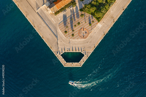 Aerial overhead drone shot of Adriatic Pearl park by Dubrovnik bridge in Dalmatia Croatia sunset photo