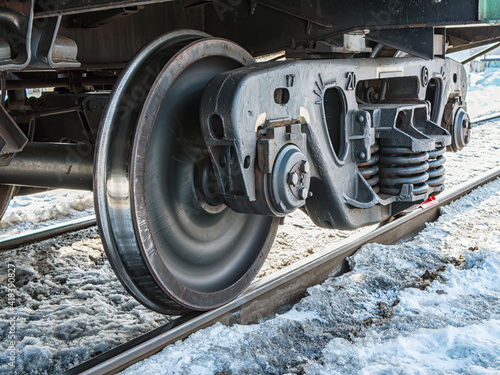 Canvastavla A railway bogie on the rails. Close-up.