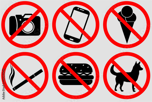 A set of signs prohibiting smoking, walking dogs, eating food, eating ice cream, taking pictures, making phone calls.