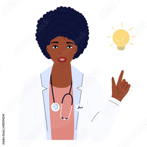 Female doctor. African American woman in a white gown. Hospital staff