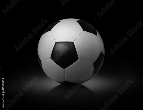 Soccer ball on black background sports team