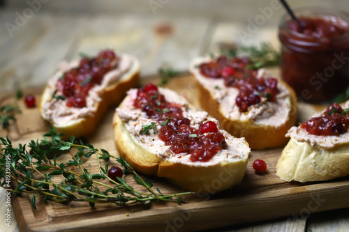 Toast with pate and cranberry jam. Goose pate toast.