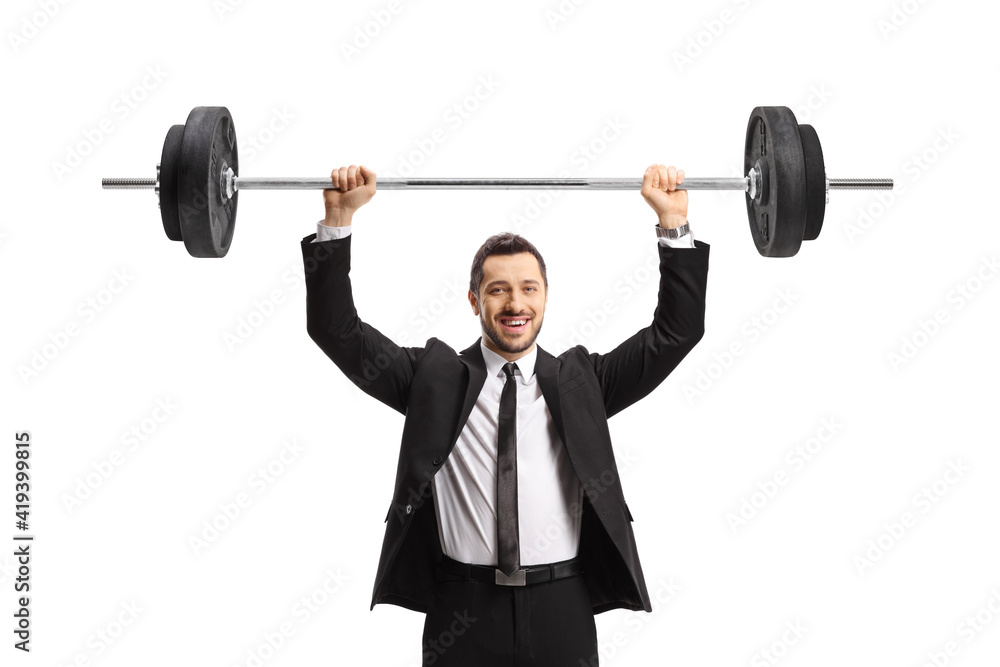 Businessman lifting weights and smiling Businessman lifting weights and smiling
