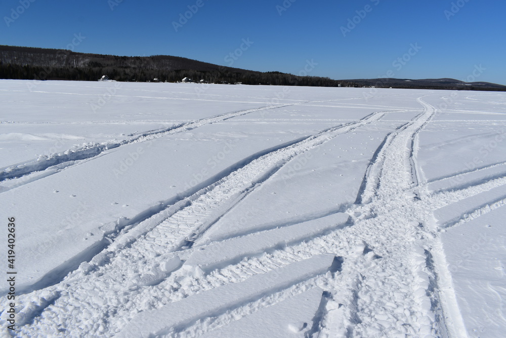 Snowmobile tracks on the lake, Lac Frontière, Québec Snowmobile tracks on the lake, Lac Frontière, Québec