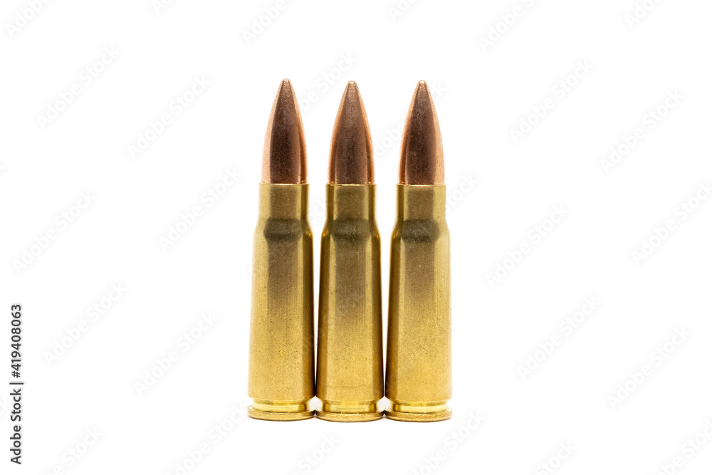 Three bullets isolated on white background. Cartridges 7.62 caliber for Kalashnikov assault rifle closeup Three bullets isolated on white background. Cartridges 7.62 caliber for Kalashnikov assault rifle closeup