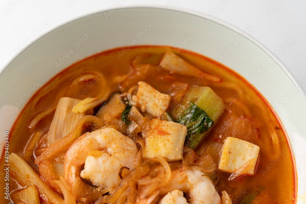 Spicy Korean-style noodle with vegetables and seafood. Spicy Korean-style noodle with vegetables and seafood.