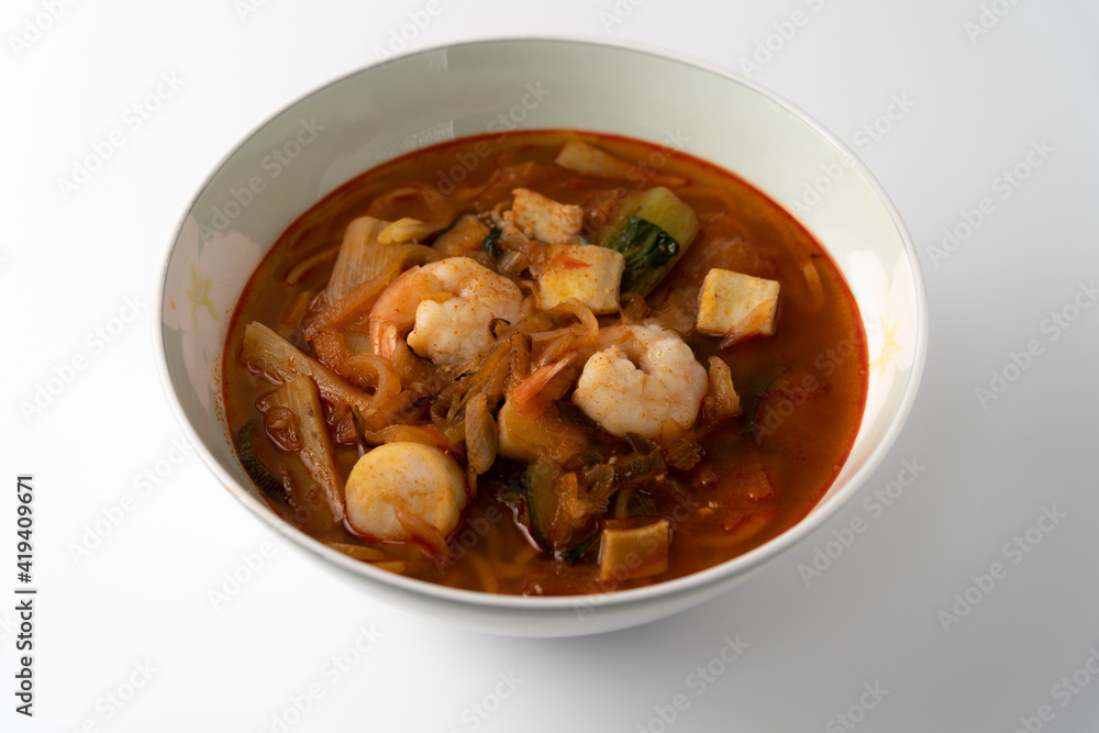 Spicy Korean-style noodle with vegetables and seafood. Spicy Korean-style noodle with vegetables and seafood.