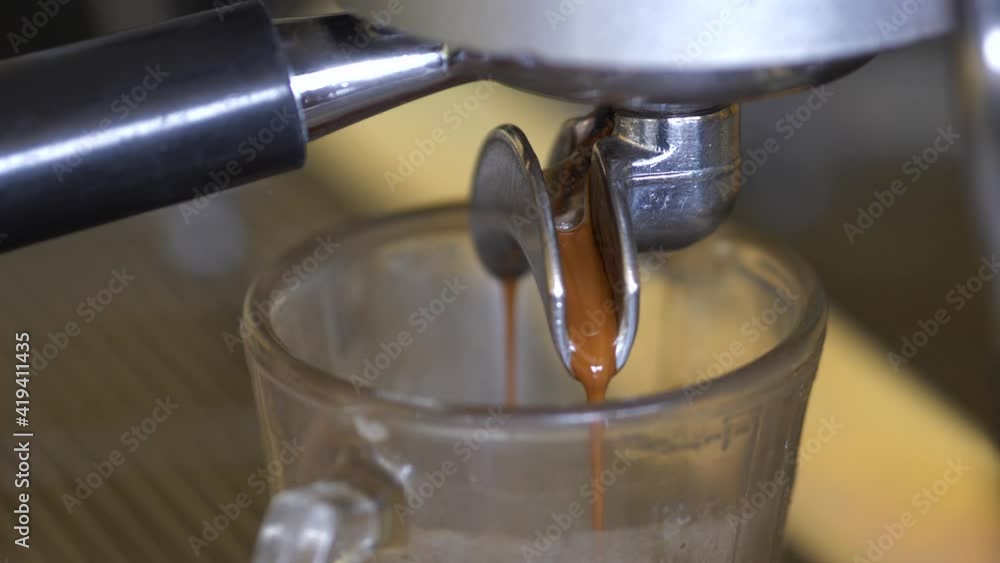 Slow Motion of coffee drop from espresso machine close up. Slow Motion of coffee drop from espresso machine close up.