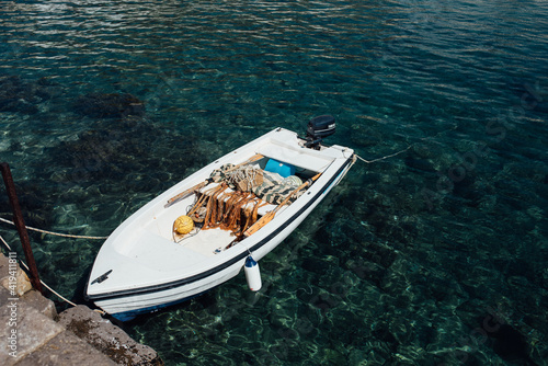 Sailboat with fishing nets in a lake photo