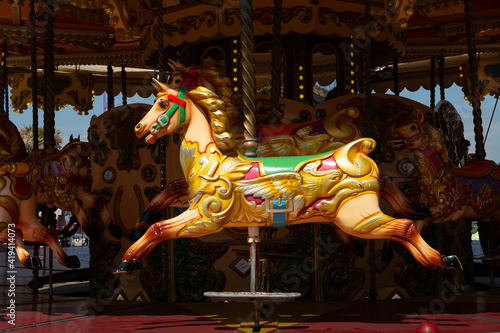 Tableau sur toile Beautiful empty colorful horse on a merry go round attraction