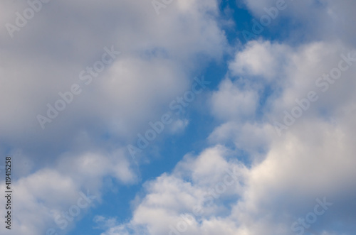 Sky, blue, saturated, bright colors and many clouds