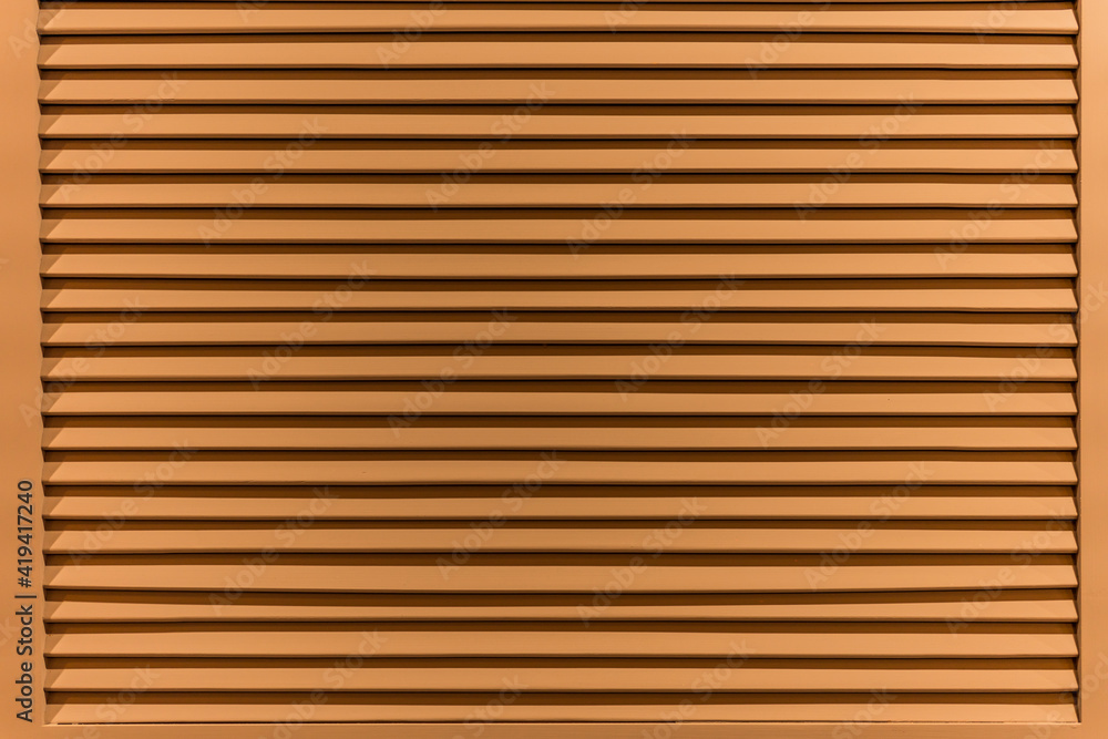 The texture of the wall is made of metal coating of huge aluminum plates of relief shape with horizontal notches. A variety of metal siding close-up The texture of the wall is made of metal coating of huge aluminum plates of relief shape with horizontal notches. A variety of metal siding close-up