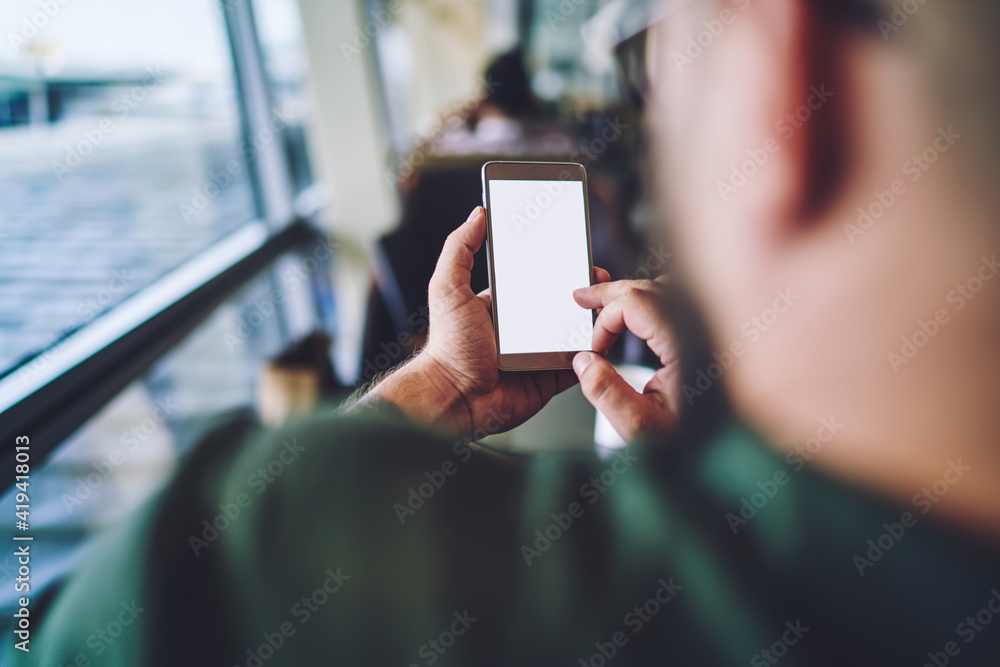 Man typing message on mobile phone