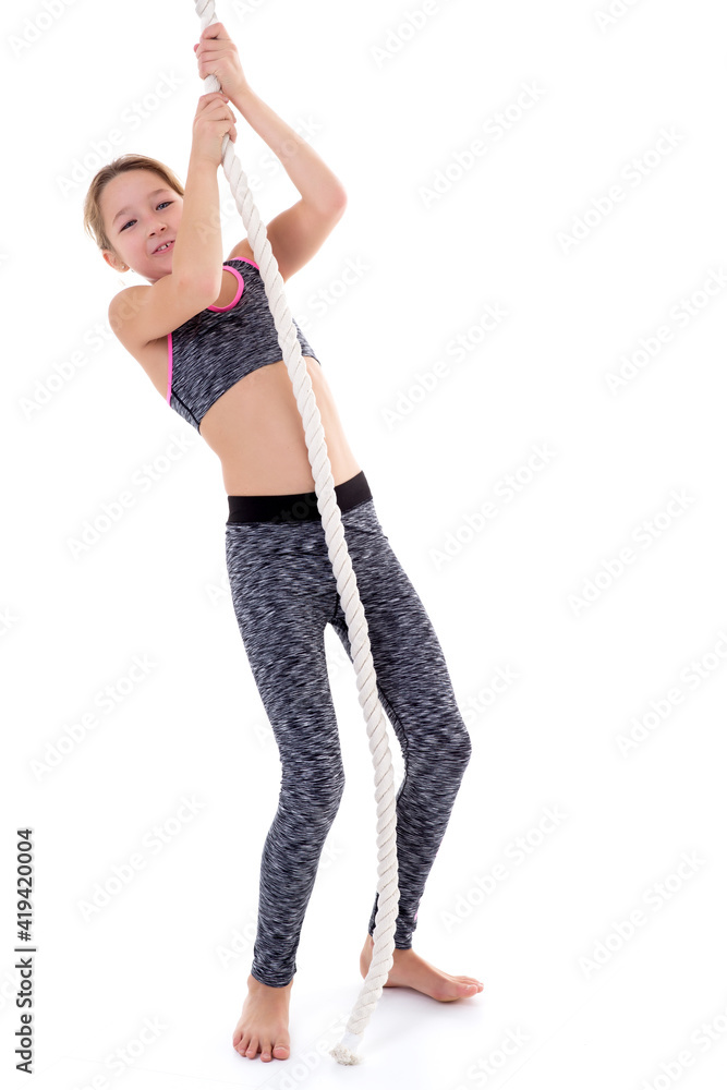 Smiling girl hanging on rope Smiling girl hanging on rope