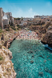 famous and crowded Lama Monachile Beach in Polignano a Mare, Puglia