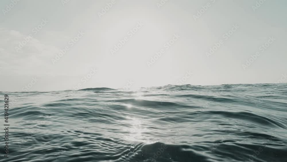 Close up of big wave passing and crashing in the sea or ocean of the beach. Paradise lifestyle concept. Underwater view outdoor.
