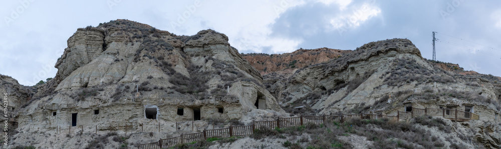 panorama view of the caves of Arguedas and the homes in the sandstone cliffs