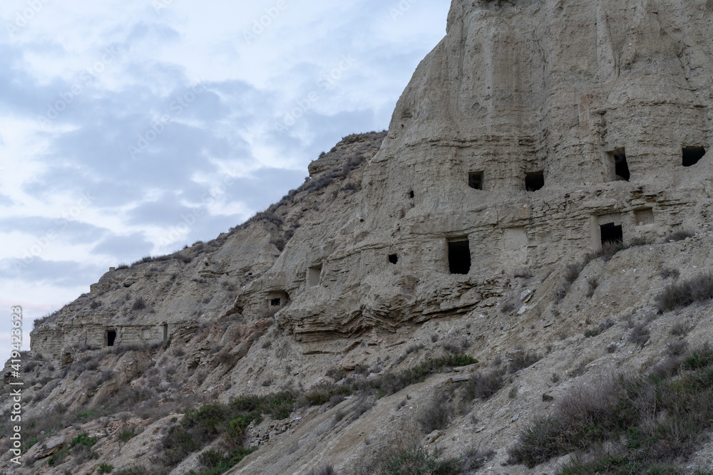 view of the caves of Arguedas and the homes in the sandstone cliffs view of the caves of Arguedas and the homes in the sandstone cliffs