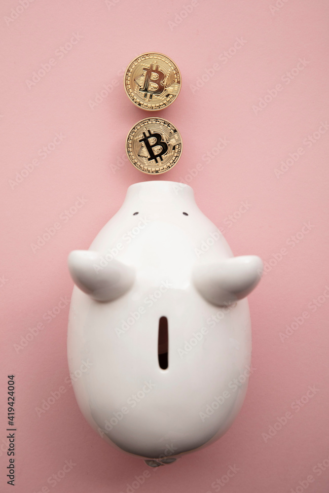 bitcoin cryptocurrency coins with a white piggy bank saving money box bitcoin cryptocurrency coins with a white piggy bank saving money box