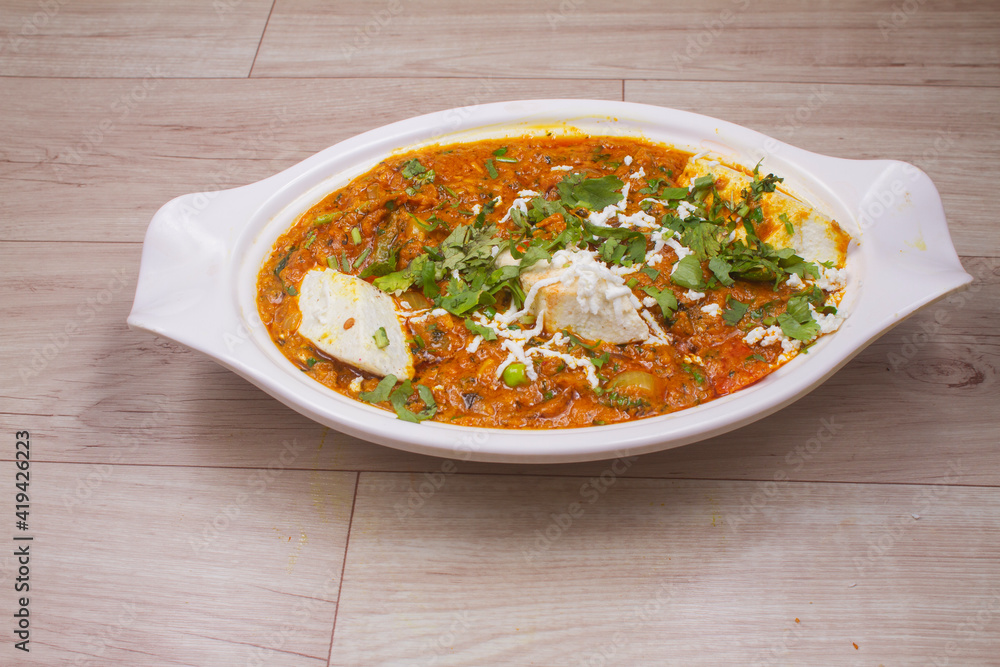 indian dish Paneer masala or paneer lachhedar served in bowl on wooden background indian dish Paneer masala or paneer lachhedar served in bowl on wooden background