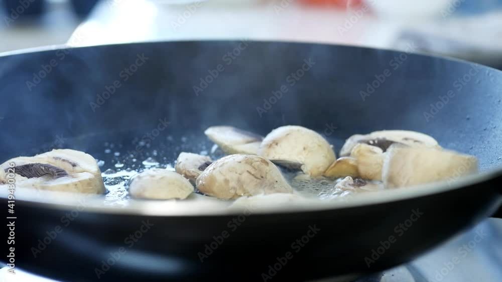 Close Up Shooting with Mushrooms Cooked in a Hot Pan Close Up Shooting with Mushrooms Cooked in a Hot Pan