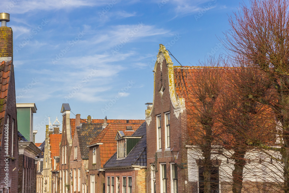 Historic facades on houses in the center of Hindeloopen, Netherlands