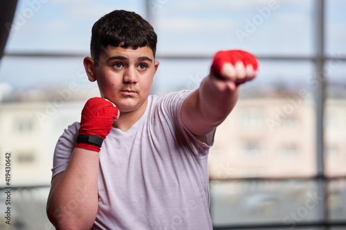 Fat kickboxer doing shadow boxing © Xalanx