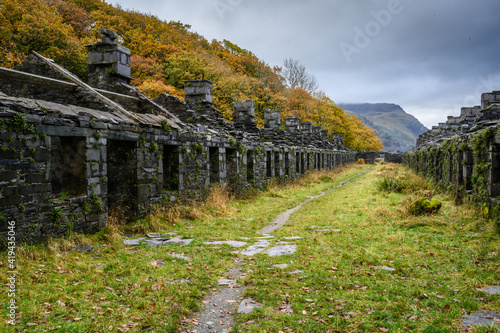 Row of ruined cottages in disused quarry in Snowdonia 7290 photo