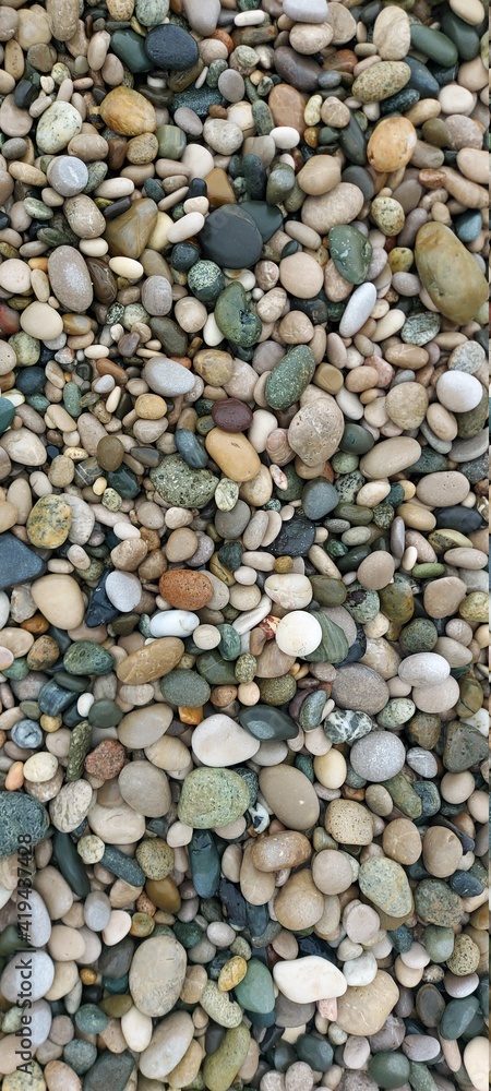 Colorful sea pebbles close-up. Backgrounds and textures. Colorful sea pebbles close-up. Backgrounds and textures.