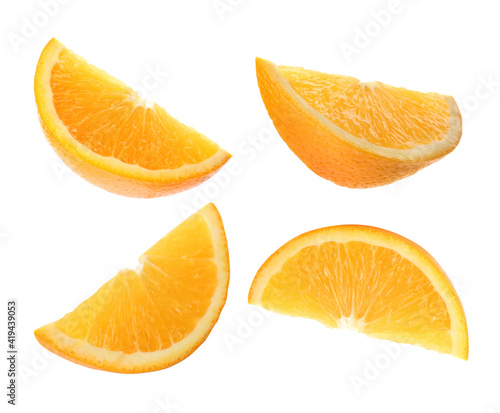 Set with tasty ripe slices of orange on white background