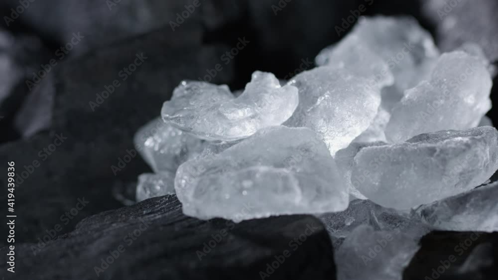 Ice lies on pieces of coal Ice lies on pieces of coal