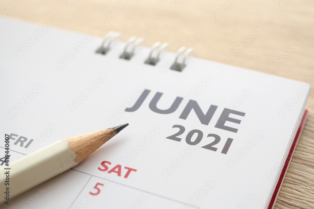 June month on 2021 calendar page with pencil business planning appointment meeting concept June month on 2021 calendar page with pencil business planning appointment meeting concept