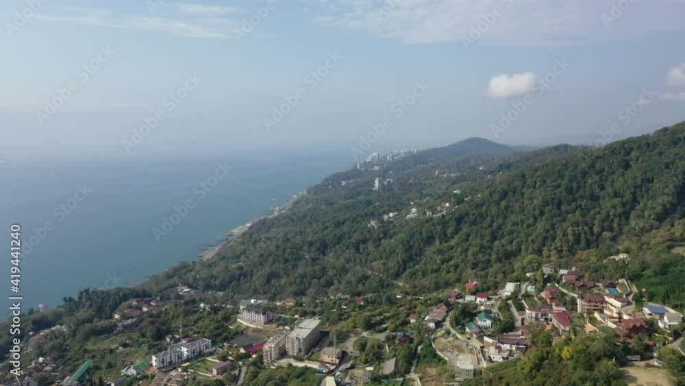 aerial drone view of coast,turquoise sea, beach train and spectacular mountain, Sochi, Russia. aerial drone view of coast,turquoise sea, beach train and spectacular mountain, Sochi, Russia.