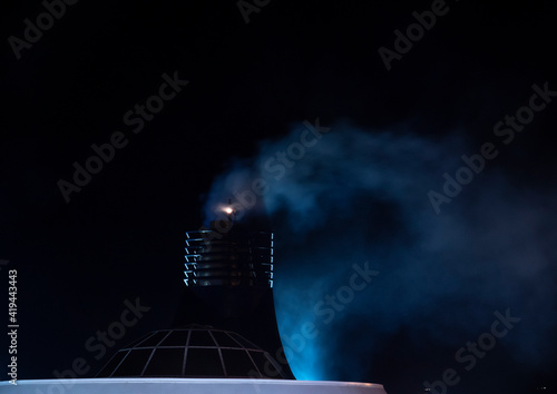 cruise ship exhaust smoke. night view passenger ship