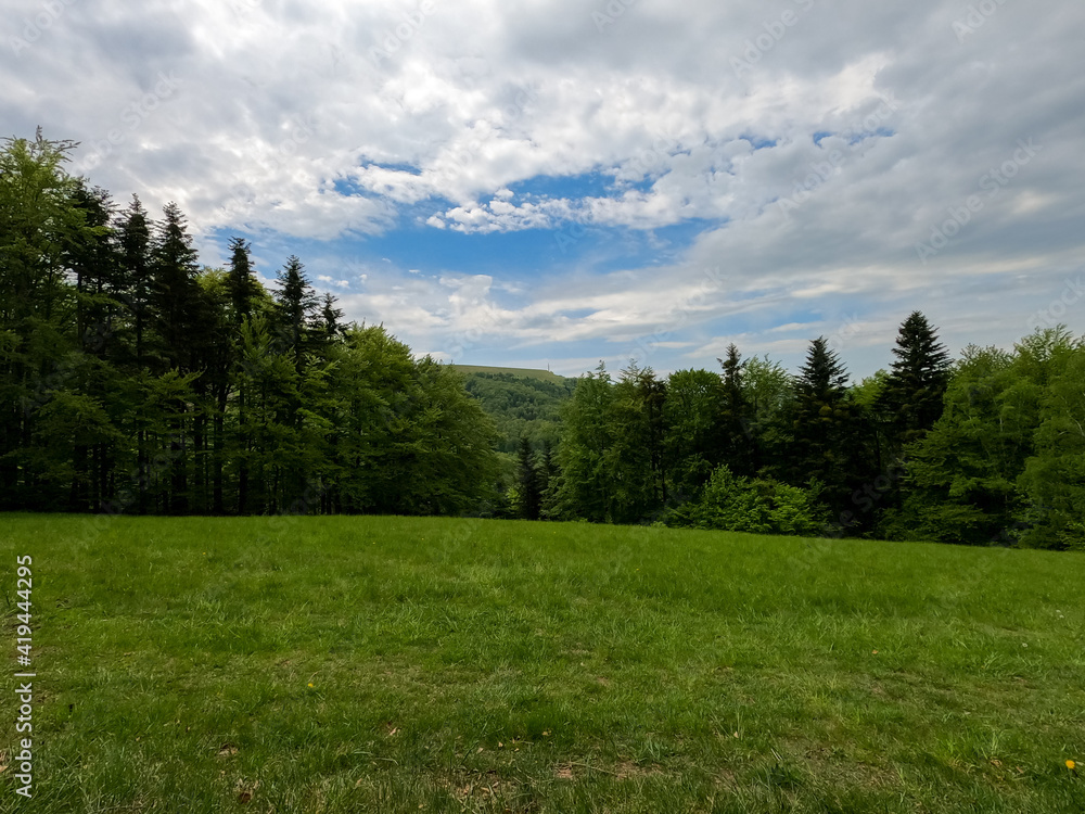 Landscape of Beskidy mountains in Poland taken in sunny spring. Mountain panorama captured during trekking. Landscape of Beskidy mountains in Poland taken in sunny spring. Mountain panorama captured during trekking.