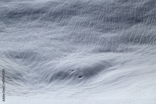 Snow surfaces drawn by the wind as in a sand desert, Italy