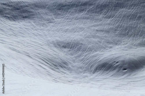 Snow surfaces drawn by the wind as in a sand desert, Italy