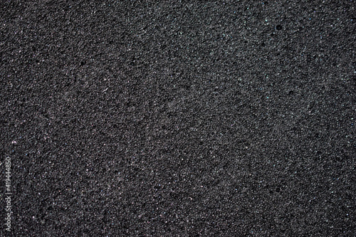 Black background made of foam rubber and polystyrene in holes