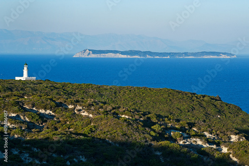 Othoni, Greece, Ionian Islands, Europe, Corfu district, north-east of the island with the lighthouse and in the background the island of Erikoussa and the Albanian coast photo