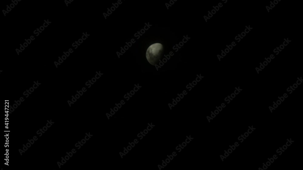 timelapse, the clouds cover the moon at night. timelapse, the clouds cover the moon at night.