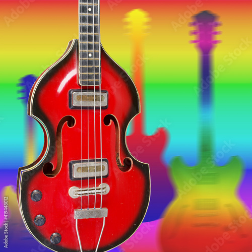 Electric guitar against the background of colored silhouettes of musical instruments. My own design.