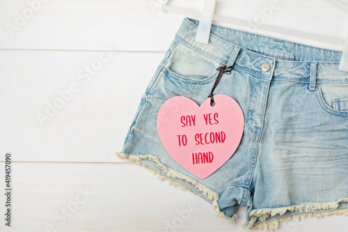 Tableau sur toile White rack with heart tag and jeans shorts