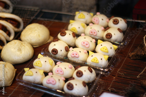 Asian street food Chinese buns in the shape of pigs 