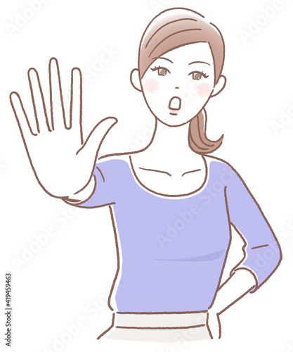手の平を前に出して拒否する女性
