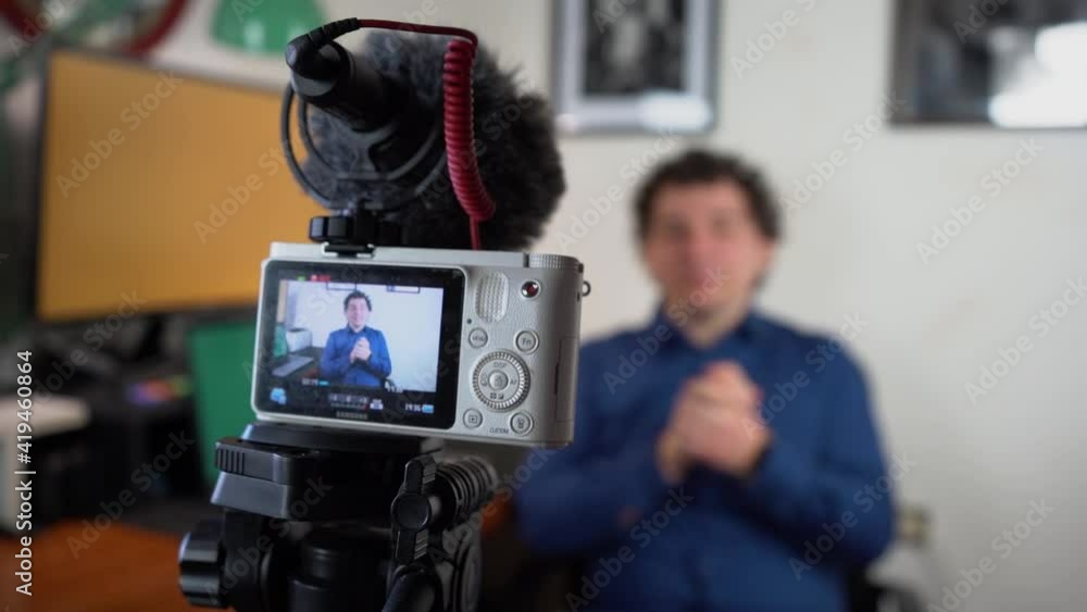 A youtuber gets ready and starts talking in the video. to then edit it and upload it to the web A youtuber gets ready and starts talking in the video. to then edit it and upload it to the web