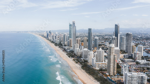 Breathtaking aerial view of modern skyscrapers located near famous sandy Surfers Paradise Beach washing by powerful ocean in Queensland